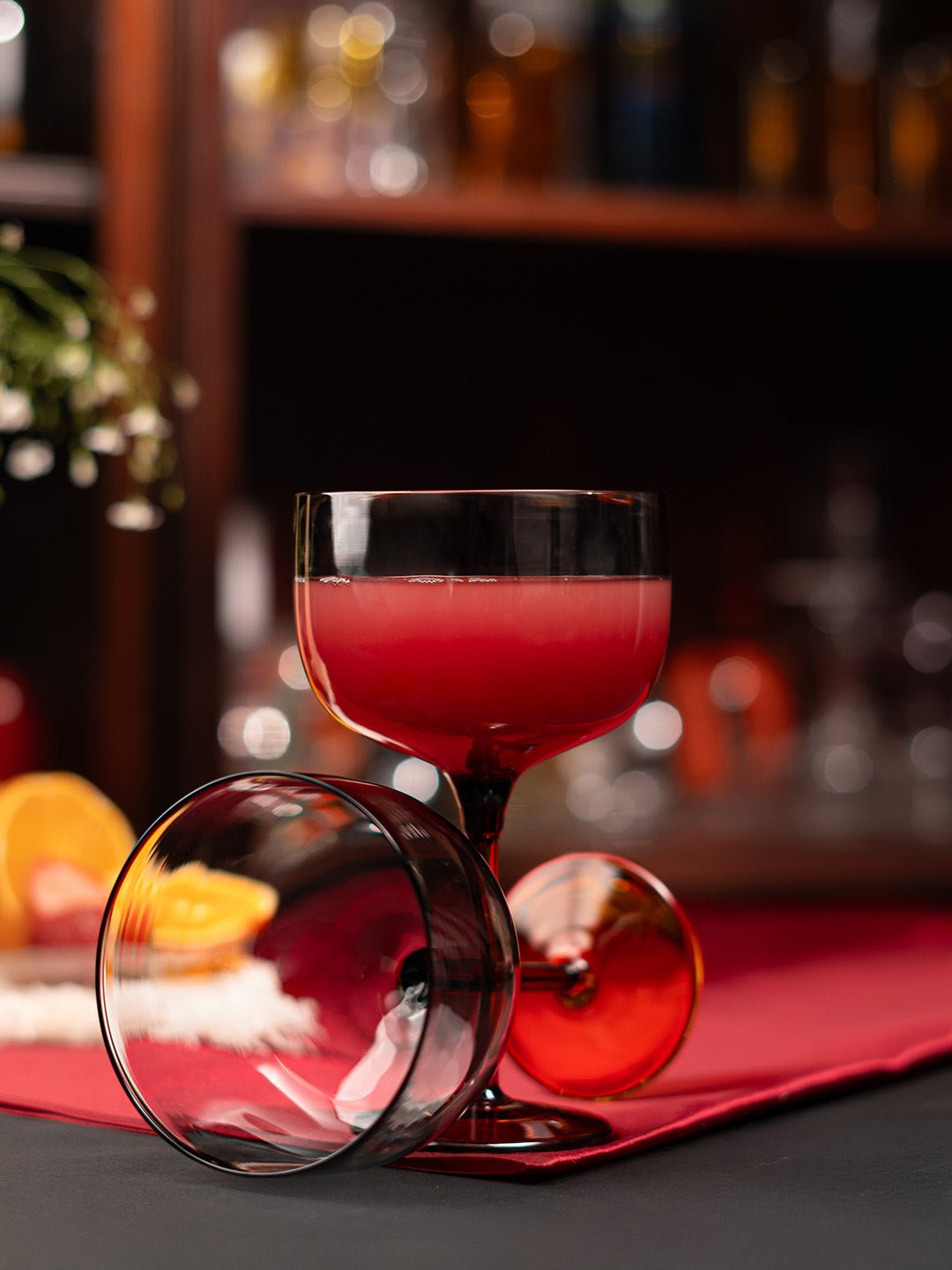 Stylish borosilicate coupe glass with a smokey grey tint, adding elegance to any drink presentation.