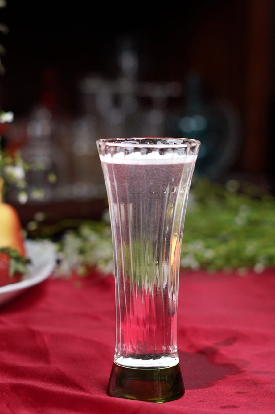 Borosilicate ribbed juice glasses with green base, stylish and durable for everyday use or special occasions.