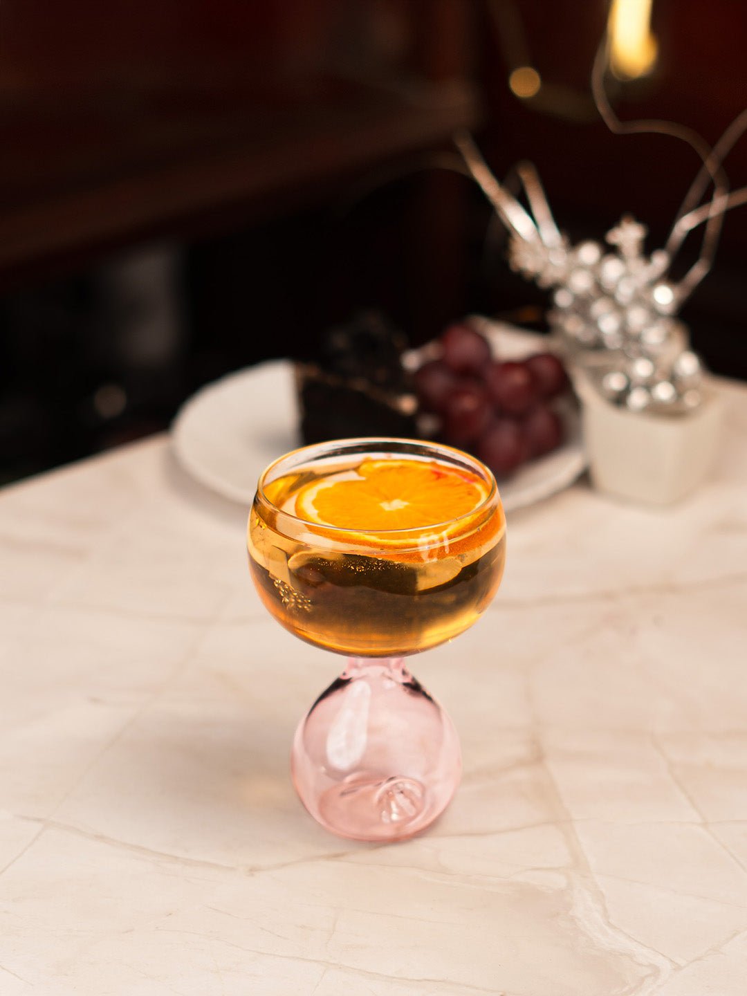 A beautifully plated dessert served in a pink Blossom Orb coupe, enhancing the dining experience.