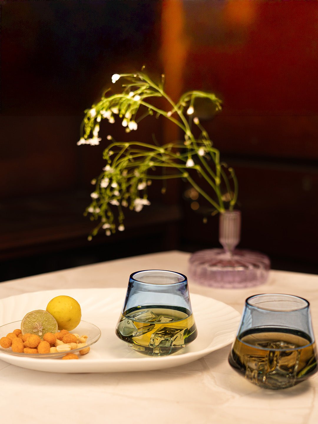 Transparent Celestia Harmony glass showcasing its artistic, swaying design for a modern touch.