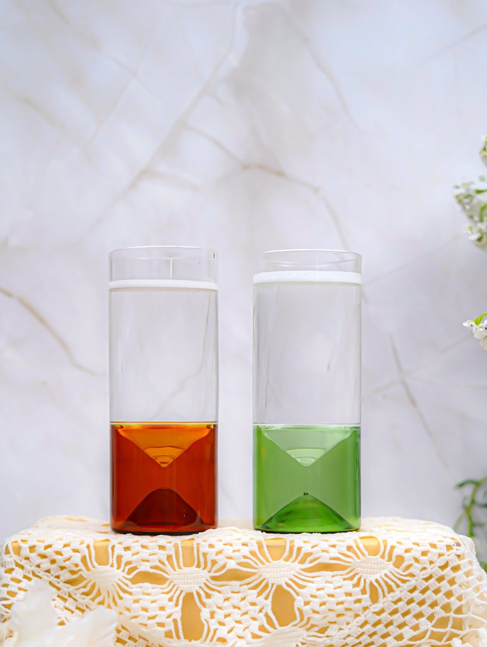 Borosilicate geometric base highball glass, 260ml, 165mm tall, with a sleek green base for a modern look.