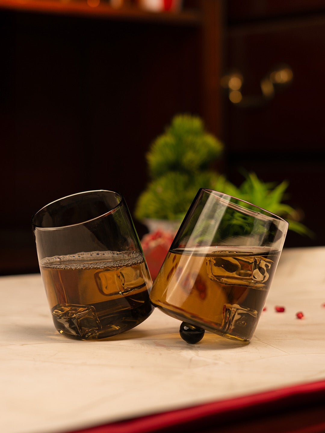 Gravity Swing whiskey glass with a unique tilted design, perfect for savoring whiskey in style.