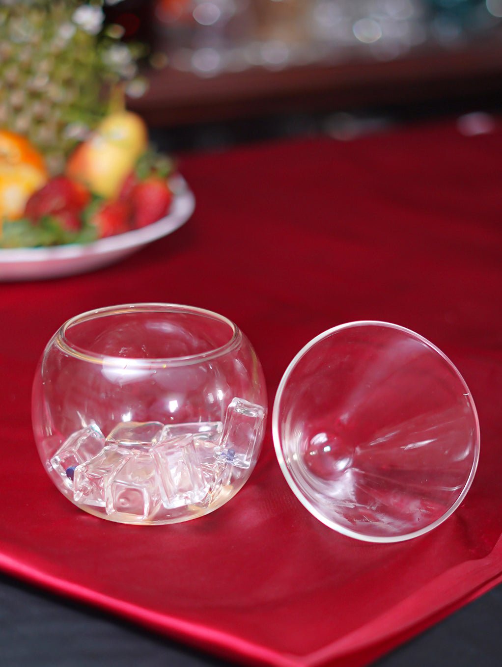 Transparent borosilicate fishbowl cocktail glass, 160ml, showcasing its round, modern shape for unique drinks.